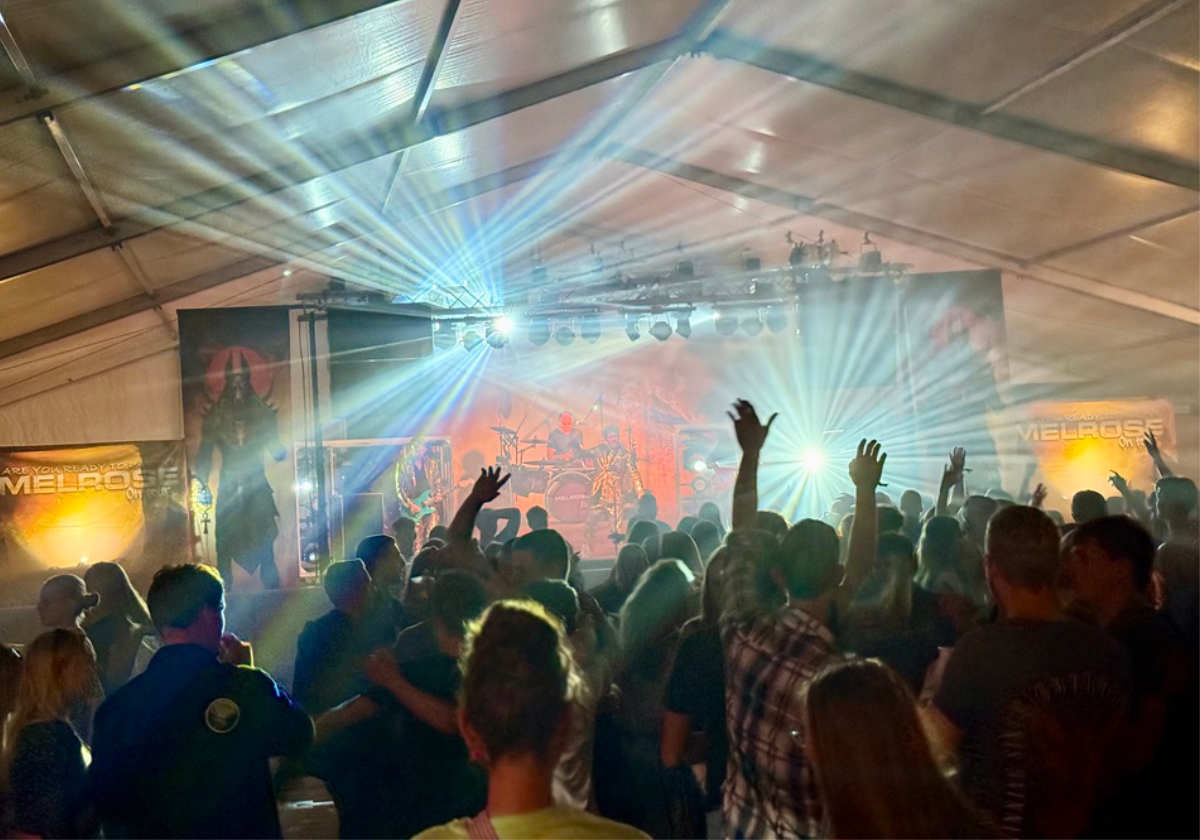 A bustling crowd gathers around melroe