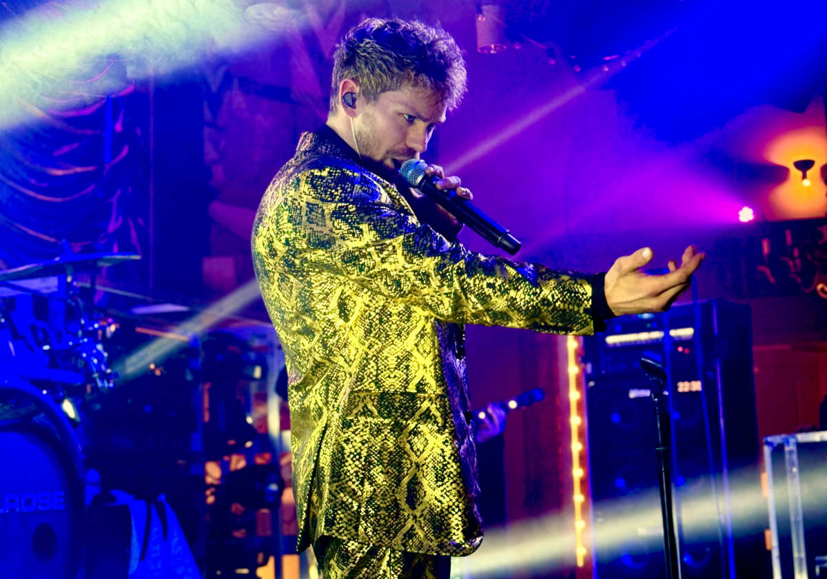 Person enjoying live music performance